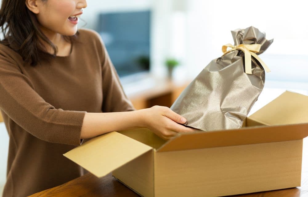 A woman receiving a happy present