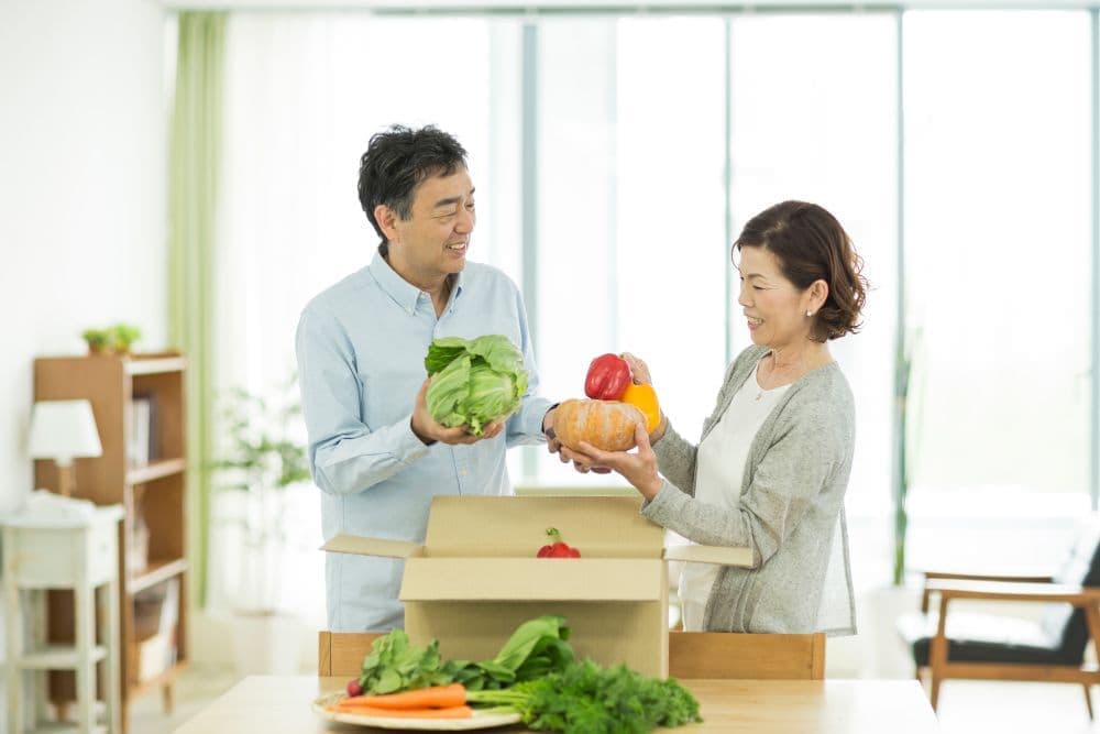  A happy old couple preparing to deliver a present